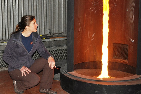 Researcher looking at a fire whirl in a cylinder